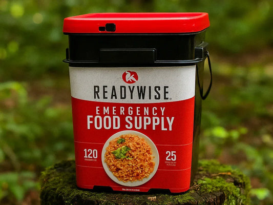 ReadyWise emergency food supply bucket on a tree stump outdoors, survival meal kit