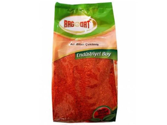 Bag of Bagdat brand ground hot red pepper spice with green and orange packaging