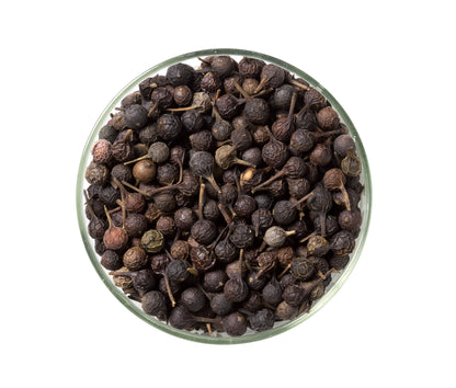 Glass bowl filled with whole dried cubeb peppercorns, Spice n Slice Market specialty spice