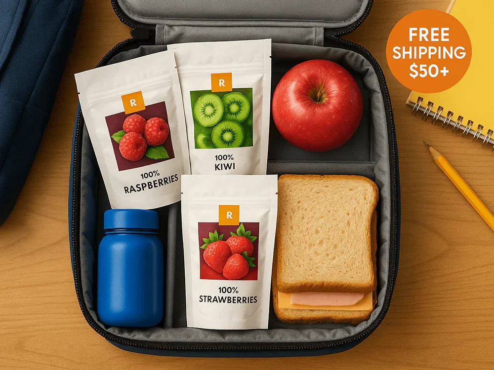 Lunchbox with dried raspberries, kiwi, strawberries, apple, sandwich, and blue bottle.