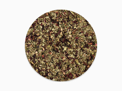 Loose leaf herbal tea blend with dried green and red leaves on white background