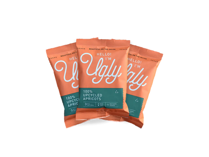 Three Hello I'm Ugly 100% upcycled apricots snack packs, orange packaging