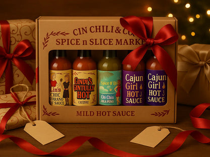 Gift set of assorted hot sauces in festive packaging with red ribbon, Christmas lights, and presents